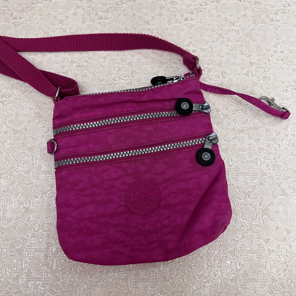 Kipling Crossbody purse. Pink/Fuchsia color.
